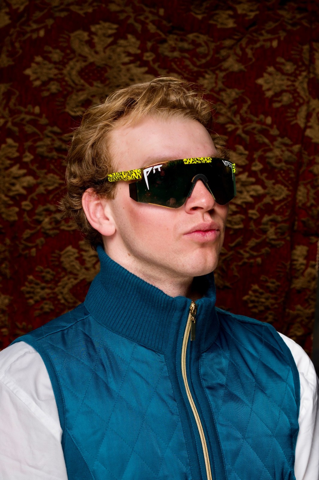 Steven, founder of Slider Up SLC, wearing Pit Viper sunglasses and a teal vest